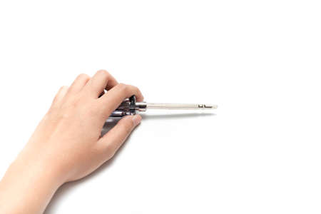 left hand holding screwdriver isolated on white backgrondの写真素材