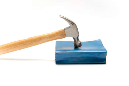 hammer with book isolated on white backgroundの写真素材