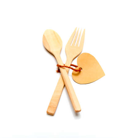 spoon and fork wood with heart tag isolated on white background