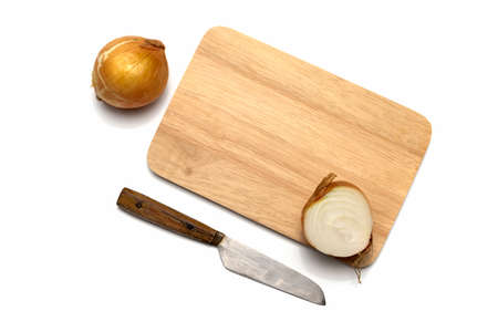 onion on cutting board with knife isolated on with backgroundの写真素材