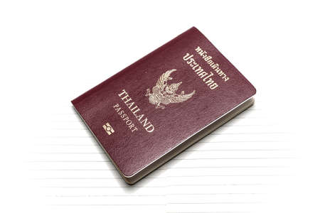 passport on notebook backgroundの写真素材