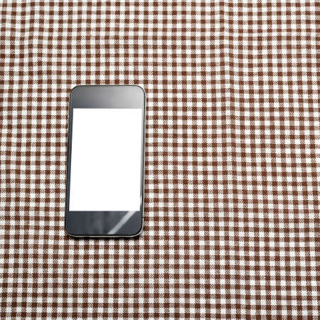 smart phone on kitchen towel backgroundの写真素材