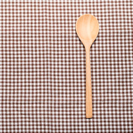 wood spoon on kitchen towel backgroundの写真素材