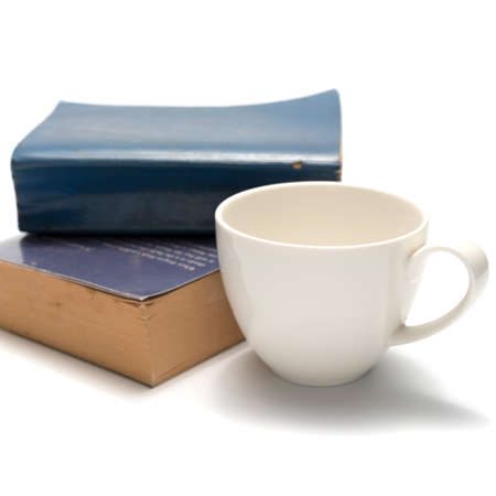 stack of book and coffee cup isolated on white backgroundの写真素材