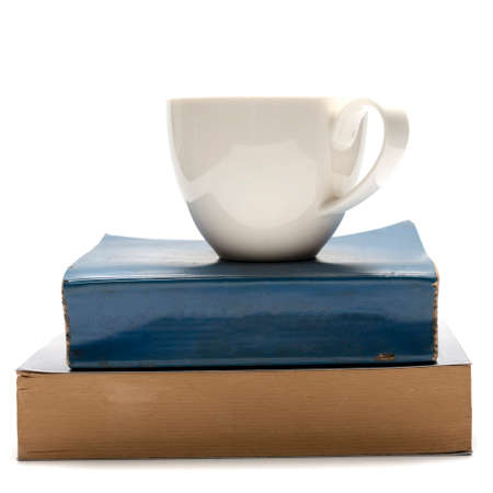 stack of book and coffee cup isolated on white backgroundの写真素材