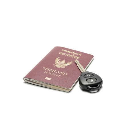passport and car key isolated on white backgroundの写真素材