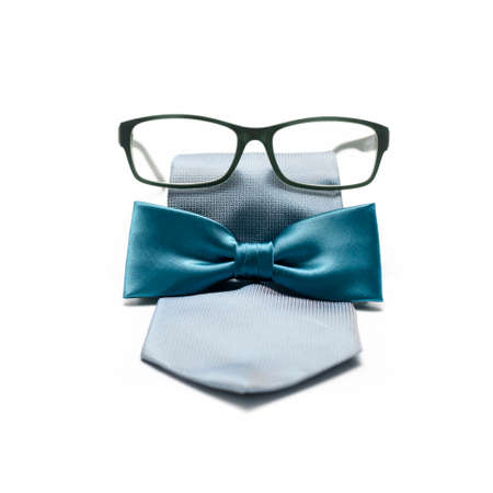 tie and bow  with eyeglasses isolated on white backgroundの写真素材