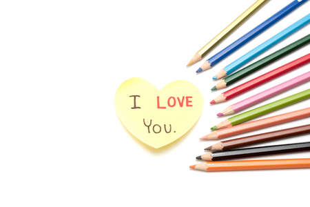 I love you write on heart paper card with color pencil isolated on white backgroundの写真素材