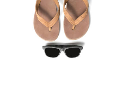 sunglasses and slippers isolated on white backgroundの写真素材