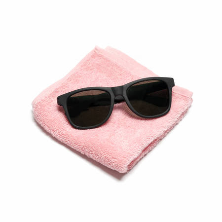 sun glasses on towel isolated on white backgroundの写真素材