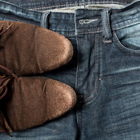 leather shoes on jean pantの写真素材