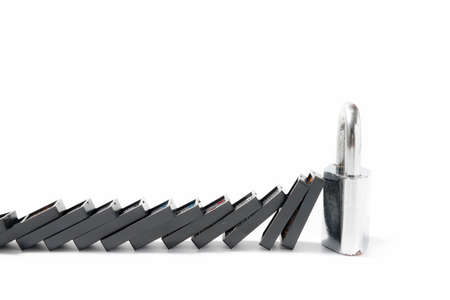 domino and padlock isolated on white backgroundの写真素材