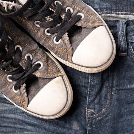 sneakers on jean pantsの写真素材