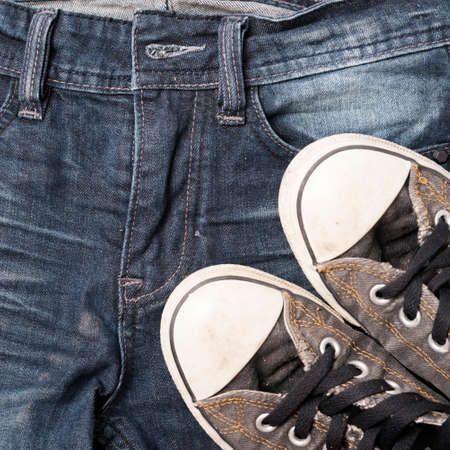 sneakers on jean pantsの写真素材