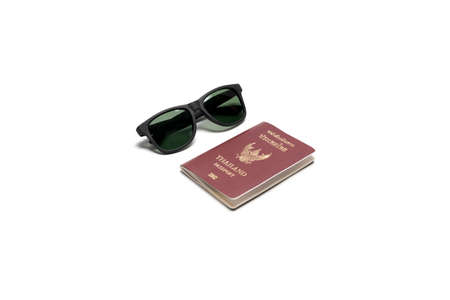 passport and sun glasses isolated on white backgroundの写真素材