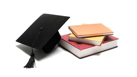 graduation cap and book isolated on white backgroundの写真素材