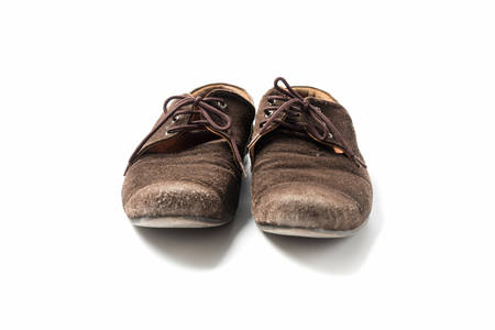 brown leather shoes isolated on white backgroundの写真素材