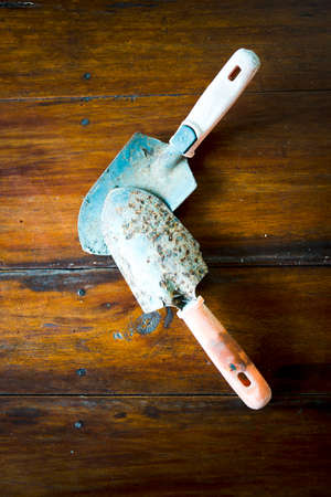 shovel on wood backgroundの写真素材