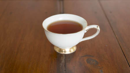 glass of tea on wood backgroundの写真素材