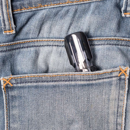 screwdriver in jean pocket pantsの写真素材