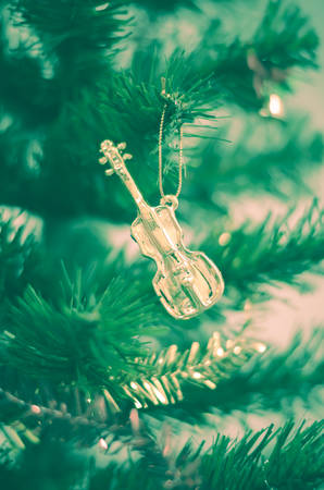 close up violin on christmas tree vintage styleの写真素材