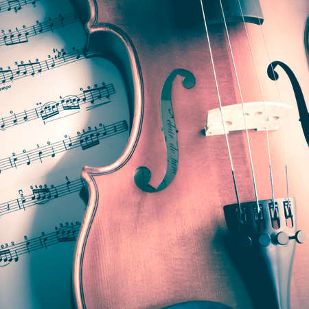 "time to practice violin" violin with sheet music on vintage styleの写真素材