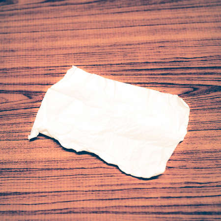 paper scrap on wood background vintage styleの写真素材
