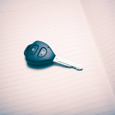 car key on notebook paper vintage styleの写真素材