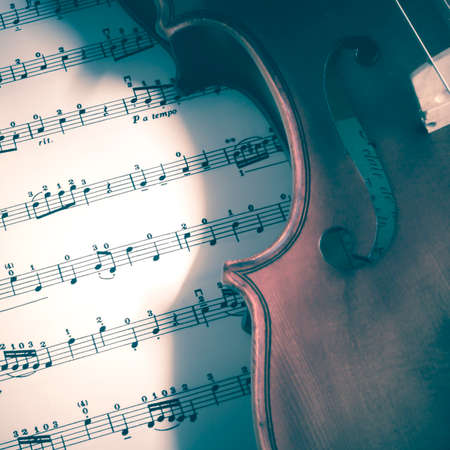 "time to practice violin" violin with sheet music on vintage styleの写真素材