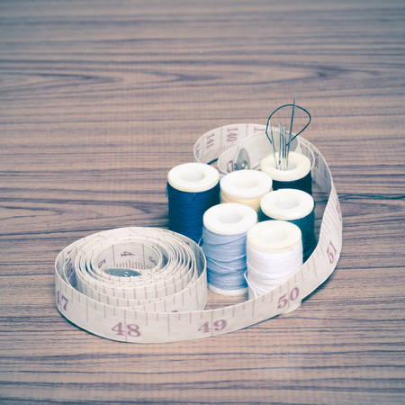 sewing kit on wood background vintage styleの写真素材