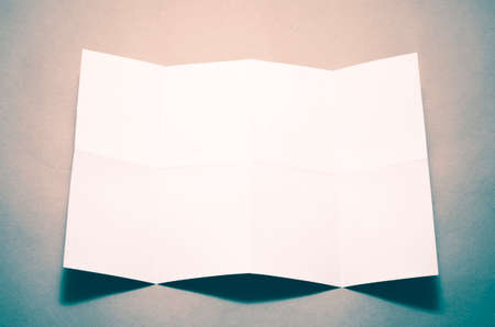 Empty white Crumpled paper on brown color background vintage styleの写真素材