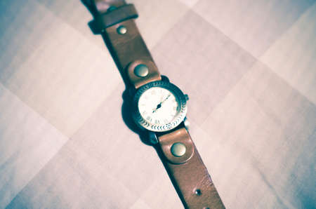 classic Wristwatch on brown tone color background vintage styleの写真素材