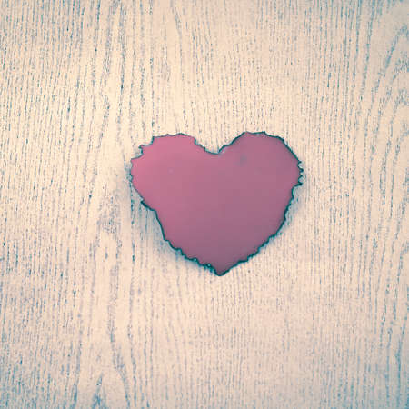 red heart on wood background vintage styleの写真素材