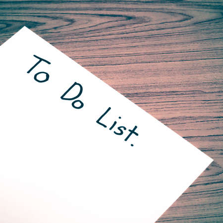 paper write to do list word on wood background vintage styleの写真素材