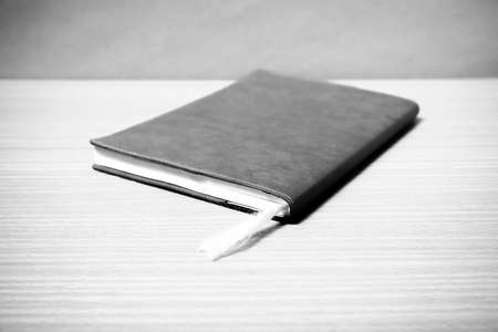 book on wood background black and white color tone styleの写真素材