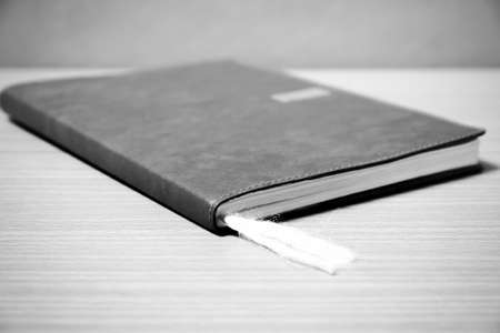 book on wood background black and white color tone styleの写真素材