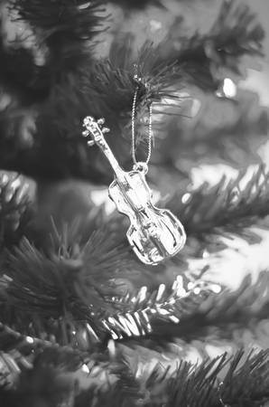 close up violin on christmas tree black and white color tone styleの写真素材