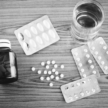 many pills to eat with water drinking concept time to take care your self black and white color tone styleの写真素材