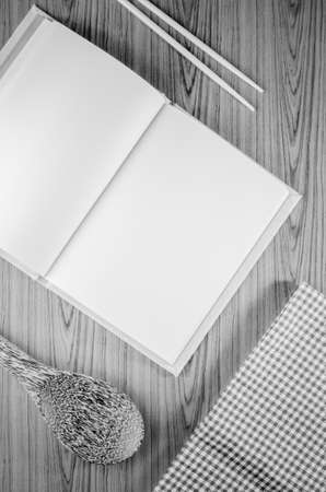 brown kitchen towel with spoon on wood black and white color tone styleの写真素材