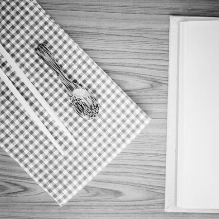 brown kitchen towel with spoon on wood black and white color tone styleの写真素材