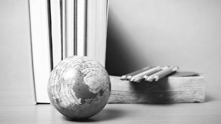 book and earth ball with color pencil on wood black and white color tone styleの写真素材