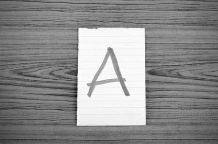 grade a on wood wall black and white color tone styleの写真素材