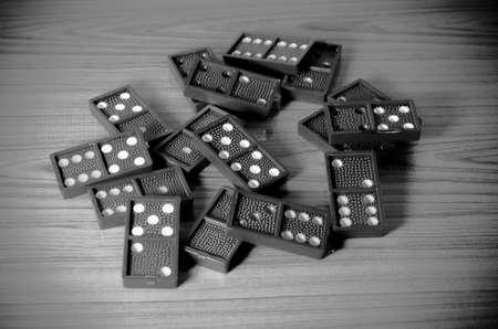 black domino on wooden black and white color tone styleの写真素材