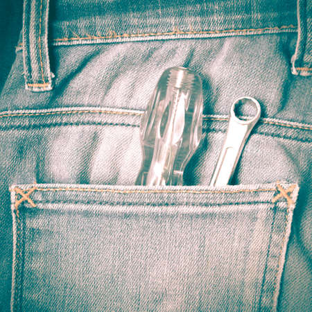 screwdriver in jean pocket pants retro vintage styleの写真素材