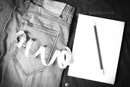 measuring tape and notebook with jean black and white tone color styleの写真素材