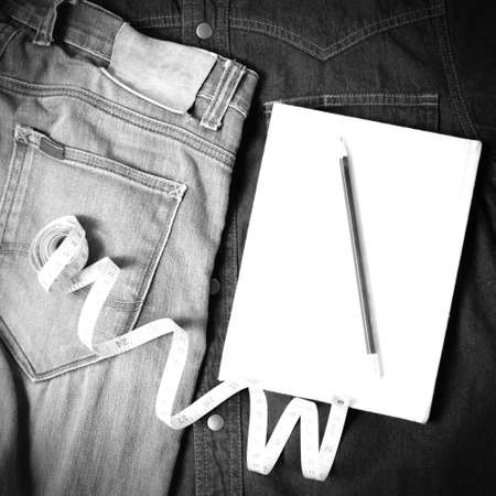 measuring tape and notebook with jean black and white tone color styleの写真素材
