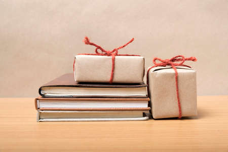 book with gift box on wood backgroundの写真素材