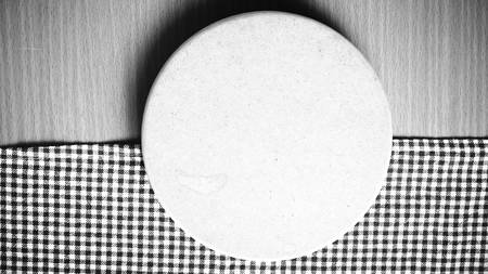 cutting board and kitchen towel on table black and white color tone styleの写真素材