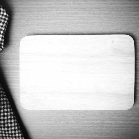 cutting board and kitchen towel on table black and white color tone styleの写真素材