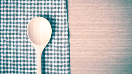 wood spoon and kitchen towel on table vintage styleの写真素材